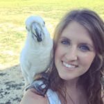 What is the best way to handle biting during a training session with a cockatoo?